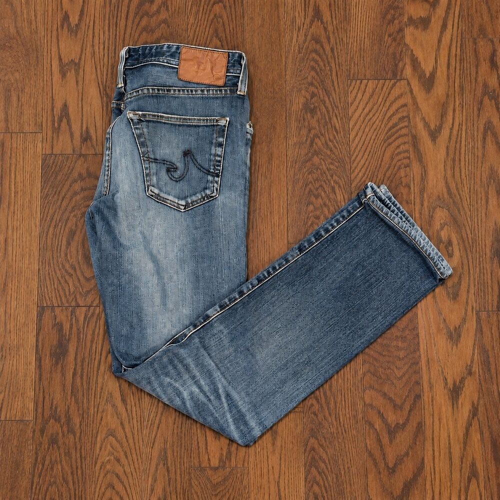 {AG Adriano Goldschmied} The Graduate distressed tailored-leg jeans, 31